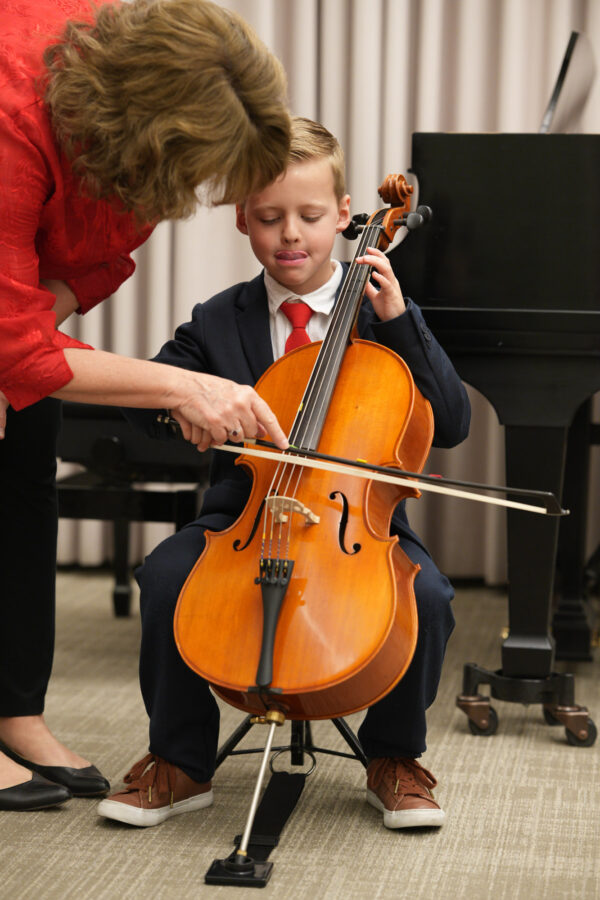 Robin Reinarz teaches a young cello student.